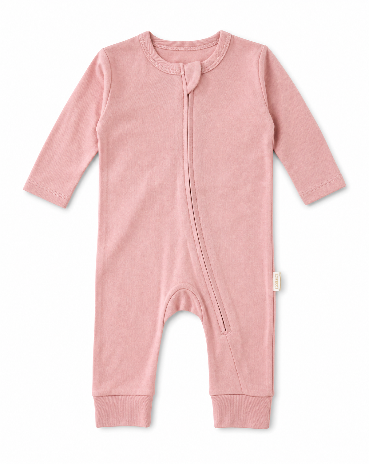 A baby long-sleeve footless romper in dusty pink, featuring an asymmetrical zipper closure and a small fabric tag on the side, shown against a plain white background.
