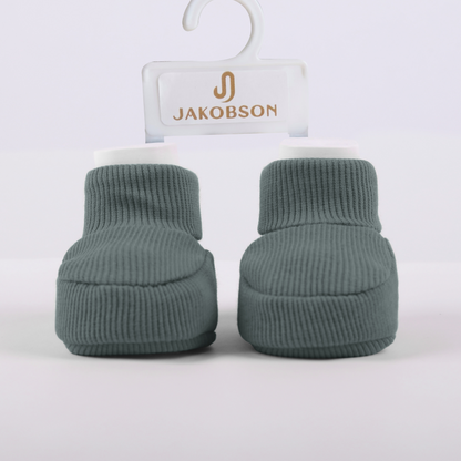 Organic cotton baby booties in green designed for newborn comfort