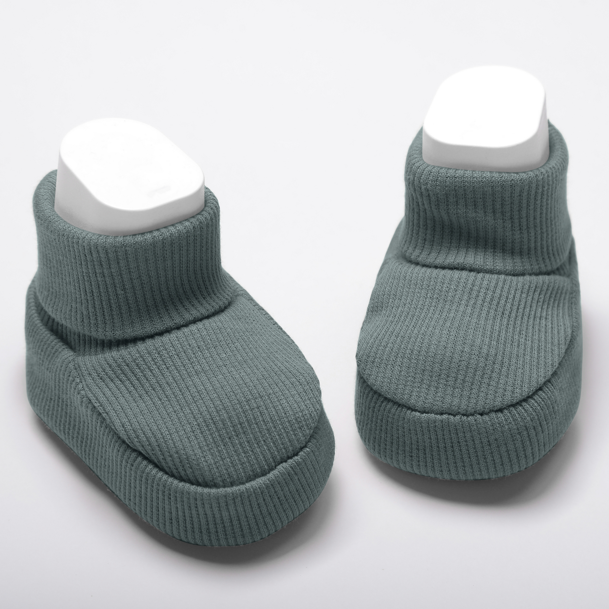 Organic cotton baby booties in green designed for newborn comfort