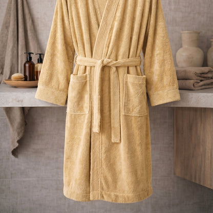 Beige robe on a wooden surface with a neutral background beige
