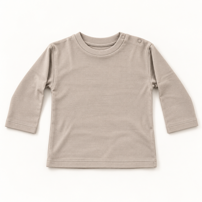 A light taupe long-sleeve baby t-shirt with a crew neck and shoulder snap button, laid flat on a white background.