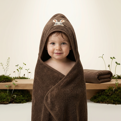 Folded dark brown hooded baby bath towel